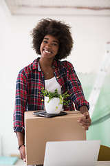 Image showing Black girl moving in the new apartment