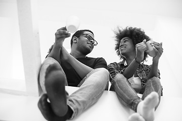 Image showing couple having break during moving to new house