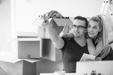 Image showing Young couple moving in a new home