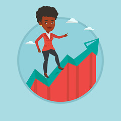 Image showing Business woman standing on growth graph.