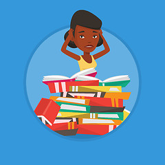 Image showing Student sitting in huge pile of books.