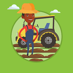 Image showing Farmer standing with tractor on background.