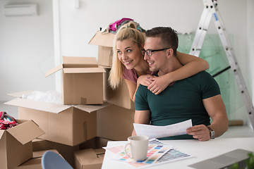 Image showing Young couple moving in a new home