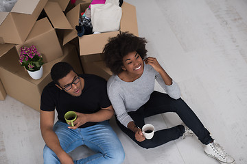 Image showing African American couple relaxing in new house