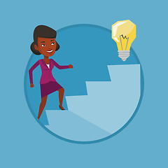 Image showing Business woman walking upstairs to the idea bulb.