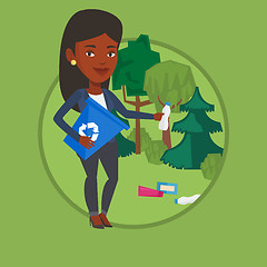 Image showing Woman collecting garbage in forest.