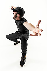 Image showing The silhouette of one hip hop male break dancer dancing on white background