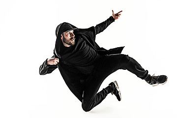 Image showing The silhouette of one hip hop male break dancer dancing on white background