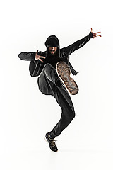 Image showing The silhouette of one hip hop male break dancer dancing on white background