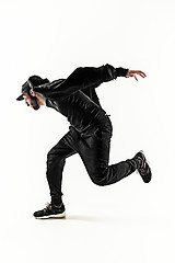 Image showing The silhouette of one hip hop male break dancer dancing on white background