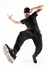 Image showing The silhouette of one hip hop male break dancer dancing on white background