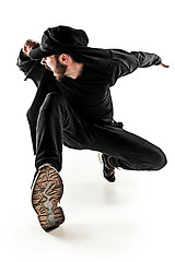 Image showing The silhouette of one hip hop male break dancer dancing on white background