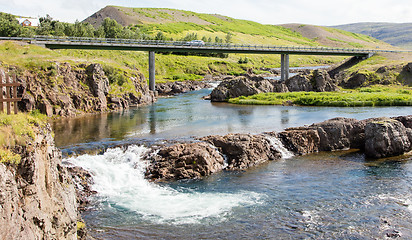 Image showing Bridge over a small river and the car on it