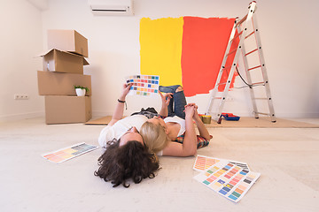 Image showing Happy young couple relaxing after painting