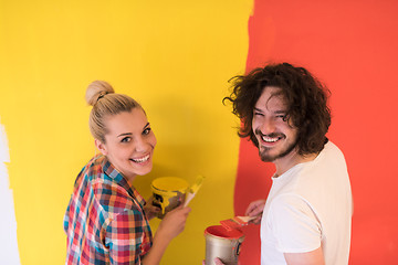 Image showing couple painting interior wall