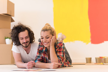 Image showing Happy young couple relaxing after painting