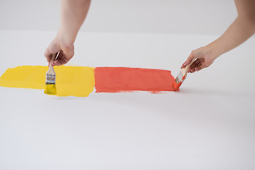 Image showing couple painting interior wall