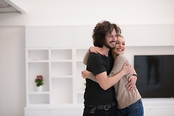 Image showing couple hugging in their new home