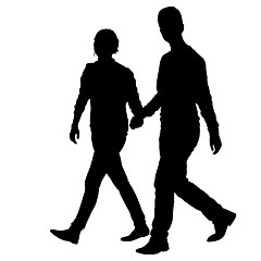 Image showing Silhouette man and woman walking hand in hand