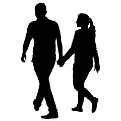 Image showing Silhouette man and woman walking hand in hand