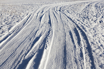 Image showing traces of the car on snow