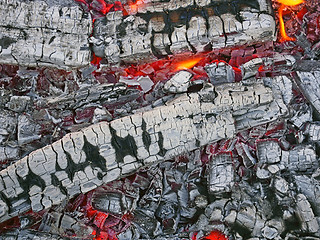 Image showing Firewood with red-hot smoldering charcoal