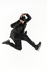 Image showing The silhouette of one hip hop male break dancer dancing on white background