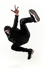 Image showing The silhouette of one hip hop male break dancer dancing on white background