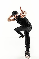 Image showing The silhouette of one hip hop male break dancer dancing on white background