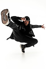 Image showing The silhouette of one hip hop male break dancer dancing on white background