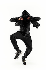 Image showing The silhouette of one hip hop male break dancer dancing on white background