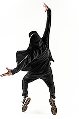 Image showing The silhouette of one hip hop male break dancer dancing on white background