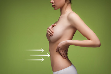 Image showing Women belly with the drawing arrows