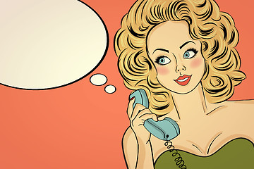 Image showing Sexy pop art woman in party dress talking on a retro phone and s