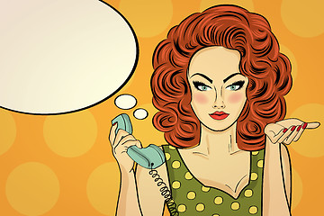 Image showing Sexy pop art woman talking on a retro phone