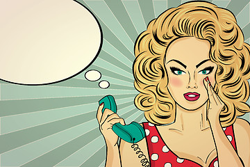 Image showing Sexy pop art woman talking on a retro phone