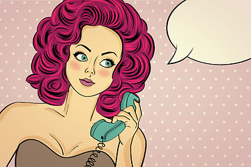 Image showing Sexy pop art woman in party dress talking on a retro phone and s