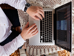 Image showing Closeup of businessman typing on laptop computer