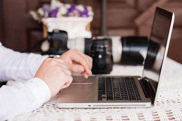 Image showing Man is looking at laptop with excitement.