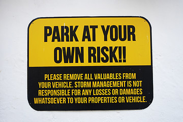 Image showing Park at your own risk sign 