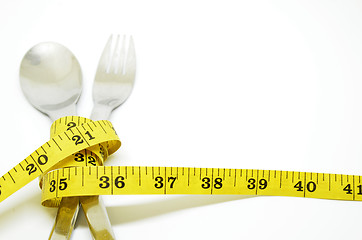 Image showing Steel spoon a fork and measuring tape