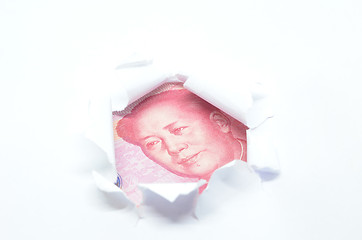Image showing China currency through torn white paper