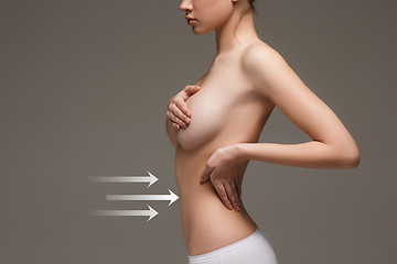 Image showing Women belly with the drawing arrows