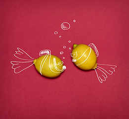 Image showing The pop art collage of fresh lemons and drawing fishes on red background