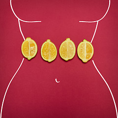 Image showing The pop art collage of female body ant fresh lemons on red background