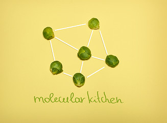 Image showing The pop art collage of Chemical molecule structure and fresh Brussels sprouts on yellow