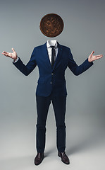 Image showing Businessman with an coin instead of his head