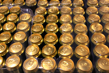 Image showing packing of tins of beer