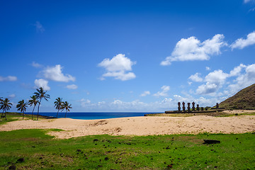 Image showing Anakena palm beach and Moais statues site ahu Nao Nao, easter is