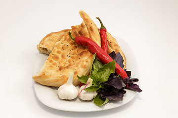 Image showing vegetables on a plate with a slice of bread